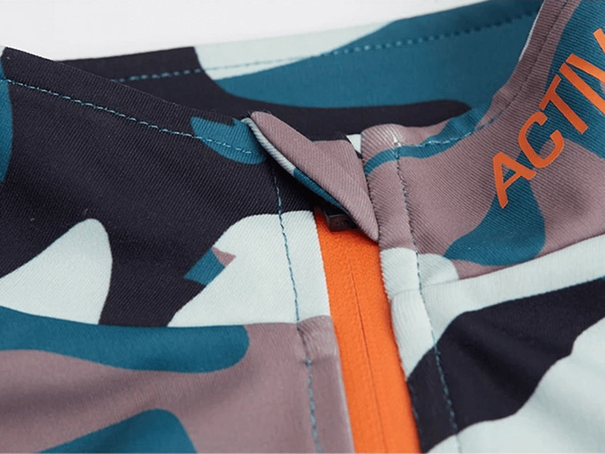 Close-up of a women's camo print sport shirt highlighting breathable fabric and dynamic design, ideal for all-season athletic wear.